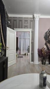 a white room with a door and a pillar at Aura in Dzerzhinskoye