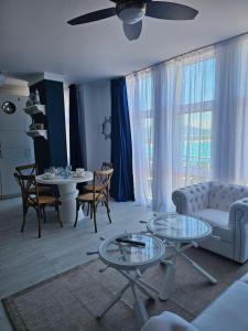 a living room with a couch and a table at Византия in Sozopol