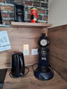 a coffee maker and a coffeemaker sitting on a counter at Chez Brigitte et Francis in Perthes