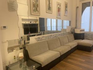 a living room with a couch and a glass table at Appartamenti Lago di Como in Valbrona +270 photos