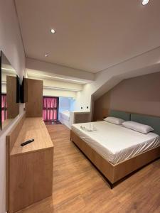 a bedroom with a large bed in a room at The Factory Boutique in Vlorë