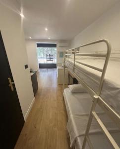 a room with two bunk beds and a hallway at Sublime Sanary plage in Sanary-sur-Mer