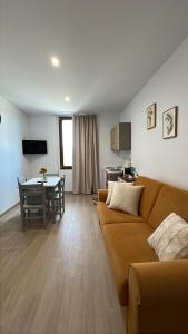 a living room with a couch and a table at La Vigna 1803 in Casa Gagliano