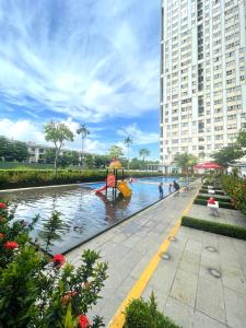 a river in a city with a large building at Cat Lai Garden Villa in Ho Chi Minh City