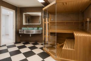 a bathroom with a sink and a mirror at Vila Natalija in Ljubljana