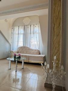 a living room with a couch and a table at Vila Natalija in Ljubljana