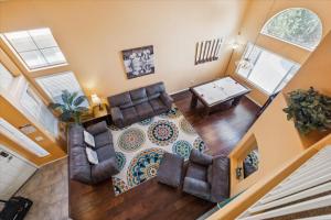 an overhead view of a living room with a couch and a table at Chandler Oasis in Chandler