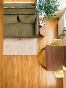 a living room with a couch and a table at Charming Duplex by Vincennes Castle in Vincennes