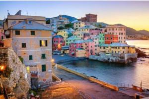 a group of buildings in a town next to the water at Casa di Ravecca in Genoa