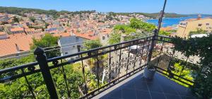 a balcony with a view of a city at Lavanda Sea View Apartment Mali Lošinj in Mali Lošinj