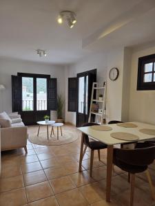 a living room with a table and a couch at Casa Velez in Vélez de Benaudalla
