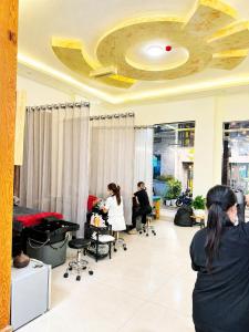 a group of people sitting in a hair salon at Lien's 2 Hotel Dalat in Da Lat