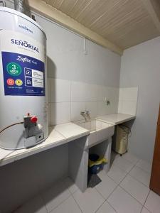 a room with a counter with a sink and a water tank at La Casita de Levene en Lobos in Lobos +6 photos