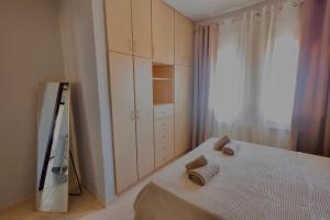 a bedroom with a bed with two pillows on it at Konitsa Valley in Konitsa