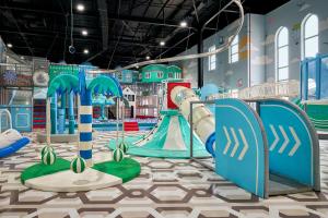 a childrens play room with a slide and a slideintend at Arda Karvon Saroy in Khiva