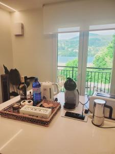 a kitchen counter with food and appliances on a counter top at El Secreto de Sandindere in Busturia +13 photos