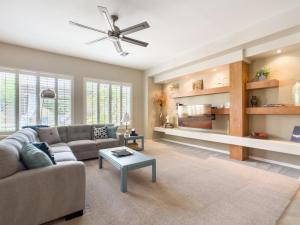 a living room with a couch and a table at Anthem Allure in Phoenix
