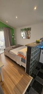 a bedroom with a large bed and a counter at Lavanda Sea View Apartment Mali Lošinj in Mali Lošinj