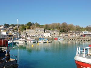a group of boats are docked in a harbor at Fistral in Saint Merryn