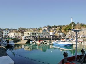 a group of boats are docked in a harbor at Treyarnon in Saint Merryn