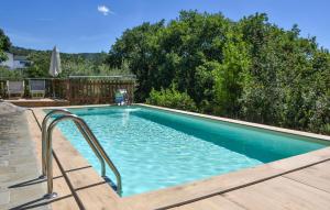 a swimming pool with blue water in a yard at Casa La Coccinella in Nestore