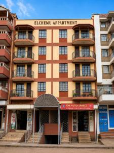 an apartment building with a sign that reads eleventh apartment at Eldo oasis in Eldoret