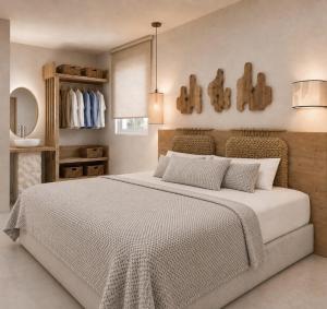 a bedroom with a large bed in a room at Sea Lily Suites Milos in Paleochori