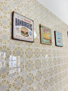 a sign for hamburgers is hanging on a wall at La Terrazza d'Abruzzo in Guardiagrele +34 photos