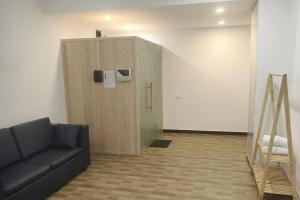 a living room with a couch and a elevator at A25 Premium Hotel - 16 Miếu Đầm in Hanoi