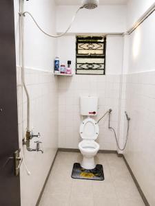 a bathroom with a toilet and a shower stall at Eldo oasis in Eldoret