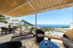 a patio with a view of the ocean at Villa La Panoramica Sea View in Capri