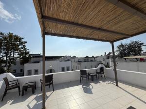 a patio with chairs and a table on a roof at CİELO Otel in Bodrum City +12 photos
