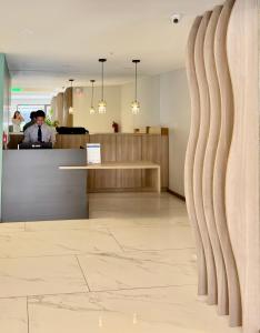 a man standing at a counter in a dental office at Modern Studio close by La Carolina Metro station in Quito +56 photos