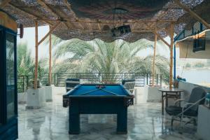 a pool table in the middle of a patio at Luxor Guest House in Luxor