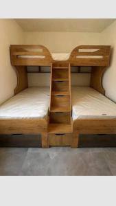 two bunk beds in a room withermott at URWURI Motel in Butare