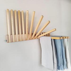a shelf with wooden bats on a wall at URWURI Motel in Butare
