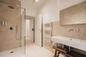 a bathroom with a sink and a glass shower at Ritrovare Country House in Citta' Sant'Angelo +28 photos