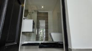 a bathroom with a toilet in a room at Lora Gardens in Chartwell