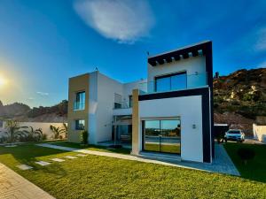 a house with a view of the ocean at Prestige Pool Retreat in Hammamet