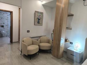 a waiting room with two chairs and a table at Prestige Pool Retreat in Hammamet +16 photos