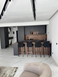 a living room with a table and chairs at AD Home in Bar