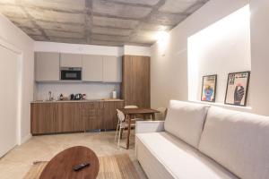 a living room with a couch and a table at Apartamentos Turísticos A Mariña Do Carril in Vilagarcia de Arousa