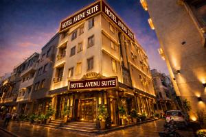 a building with a hotel a new arrive sign on it at Hotel Krone International in Gurgaon