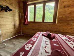 a bedroom with a bed in a room with a window at Appartamento Grande Cervino - Il Lupo Affitta in Antey-Saint-André