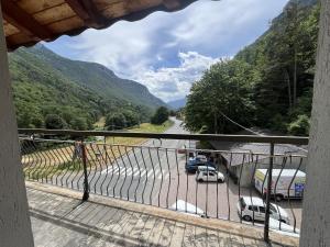 a balcony with cars parked in a parking lot at Appartamento Grande Cervino - Il Lupo Affitta in Antey-Saint-André