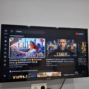 a flat screen tv with two movies on it at Byrabau Tauwer in Shchūchīnsk +8 photos
