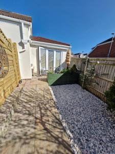 a house with a fence and a patio at Art House in Portsmouth