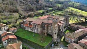 an aerial view of an old building in a village at Duplex de l'abbaye in Pébrac +20 photos
