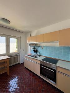 a kitchen with a sink and a stove top oven at Schöne Aussicht in Idar-Oberstein