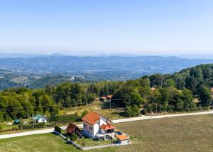 an aerial view of a house on a hill at Evergreen Escape Apartment in Užice
